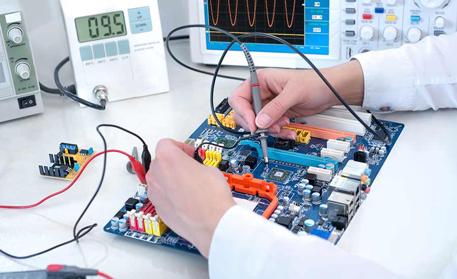 A person working on a circuit board​