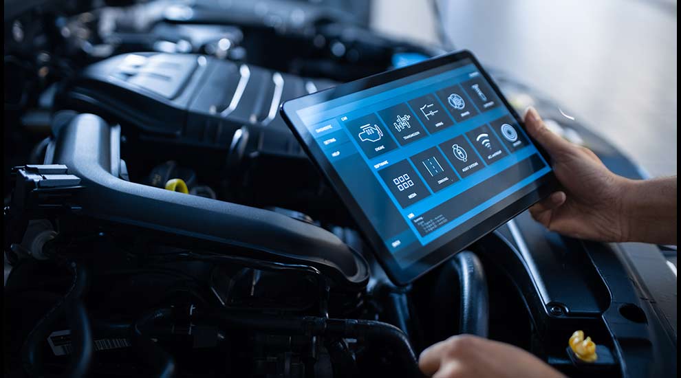 A person checking components of a car​