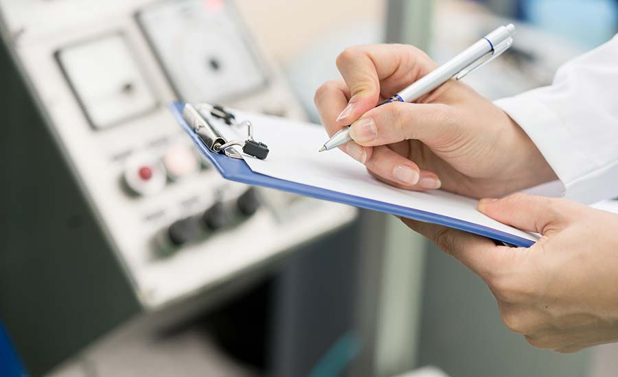 Human hand writing on a notebook